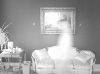 Image of a ghost in front of a sofa
